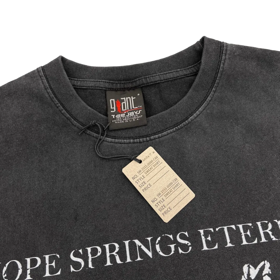 Saint Michael SAINT MICHAEL HOPE SPRING printed washed and distressed retro Vintage loose short-sleeves. Digital white ink direct printing. The fabric is breathable and the pattern is three-dimensional and clear. Fabric: Double yarn 240g Style number: S905 Size: S-M-L-XL Color: Washed black Price: P118